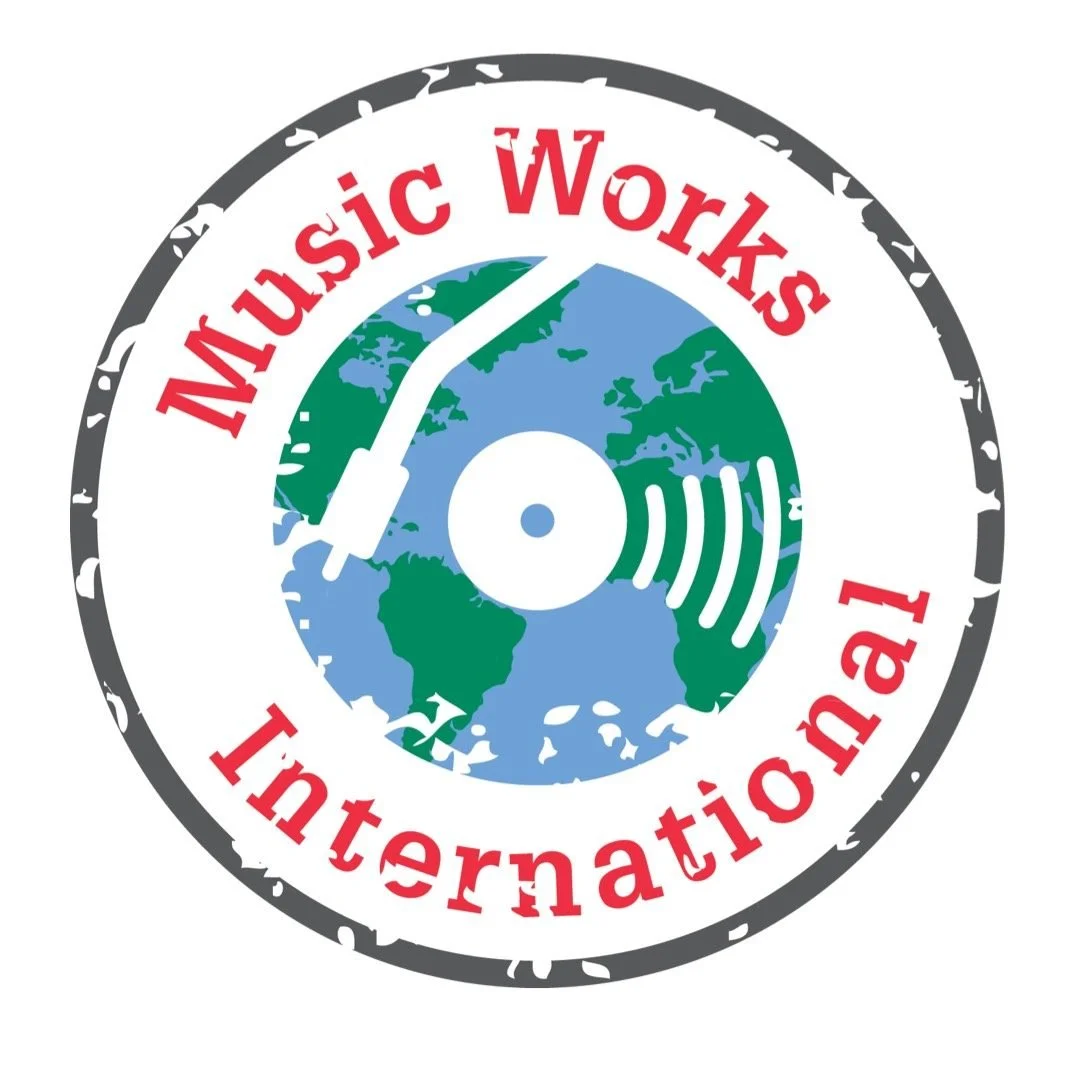 Logo for Music Works International featuring a globe, a vinyl record, and a sound wave, with red text around the border that reads 'Music Works International'.