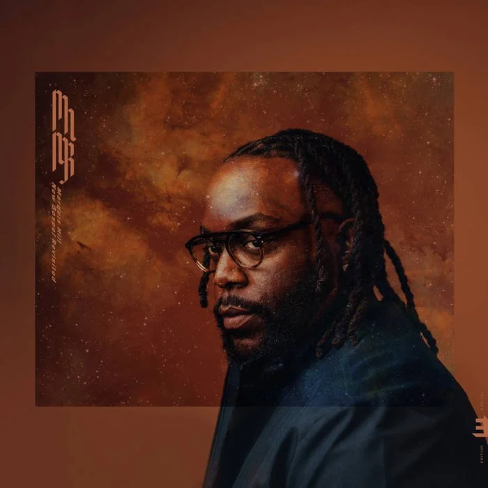 A portrait of a man with glasses and dreadlocks, set against a cosmic, star-filled background with shades of orange and brown.