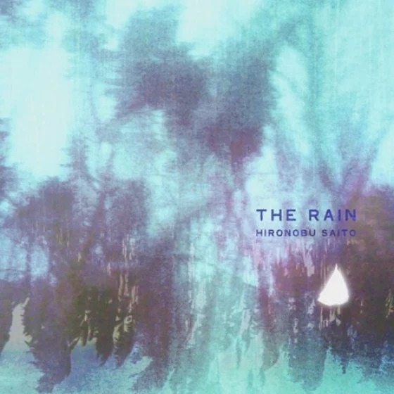 Album cover art titled "The Rain" by Hironobu Saito, featuring abstract watercolor imagery in shades of blue, purple, and green with a white triangular shape near the bottom right.