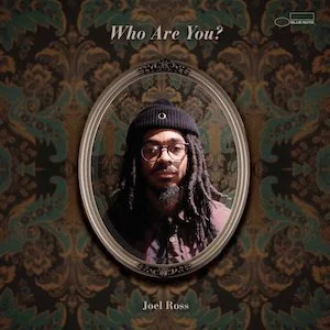 Cover of Joel Ross's album 'Who Are You?' featuring a portrait of Joel Ross with dreadlocks, glasses, and a beanie, framed in an ornate oval mirror against a patterned brown and green background.