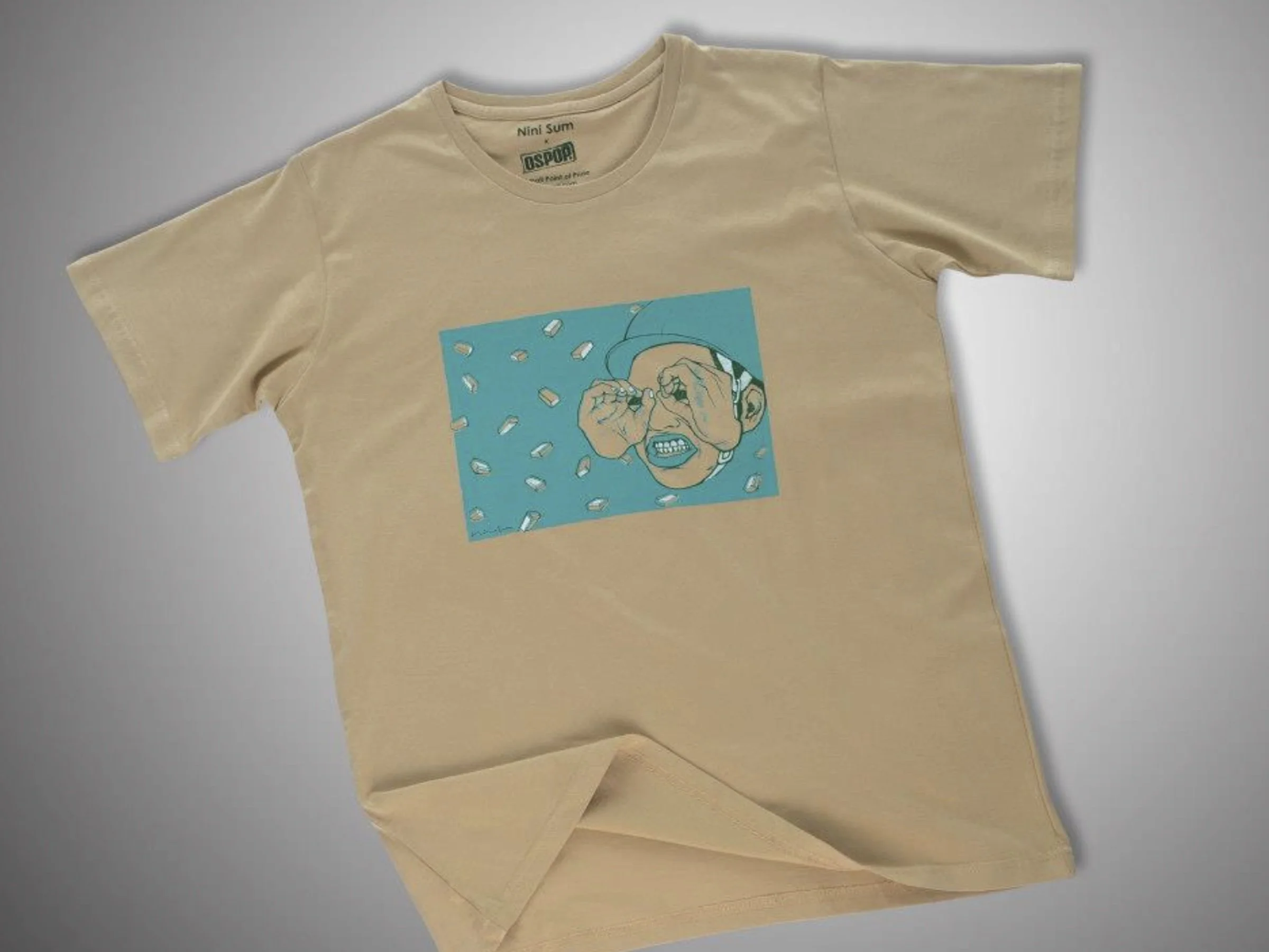 Beige t-shirt featuring the Nini Sum collaboration artwork centered on the chest.