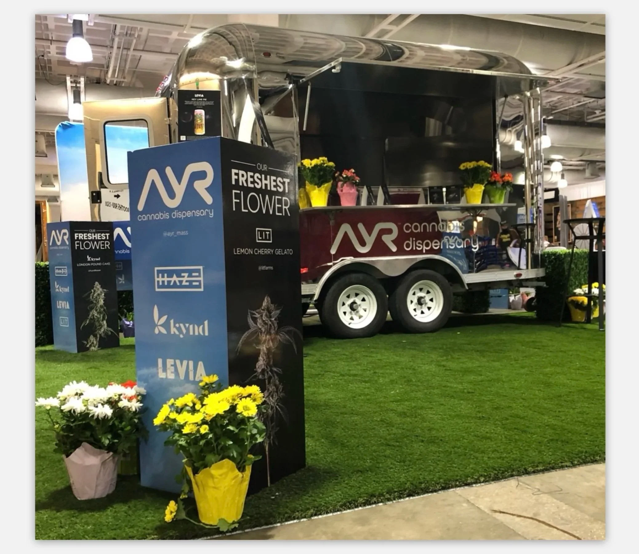 AYR Cannabis, as title sponsor of the NECANN convention, outfitted their premium booth space with an airstream and 'Our Freshest Flower' theme.