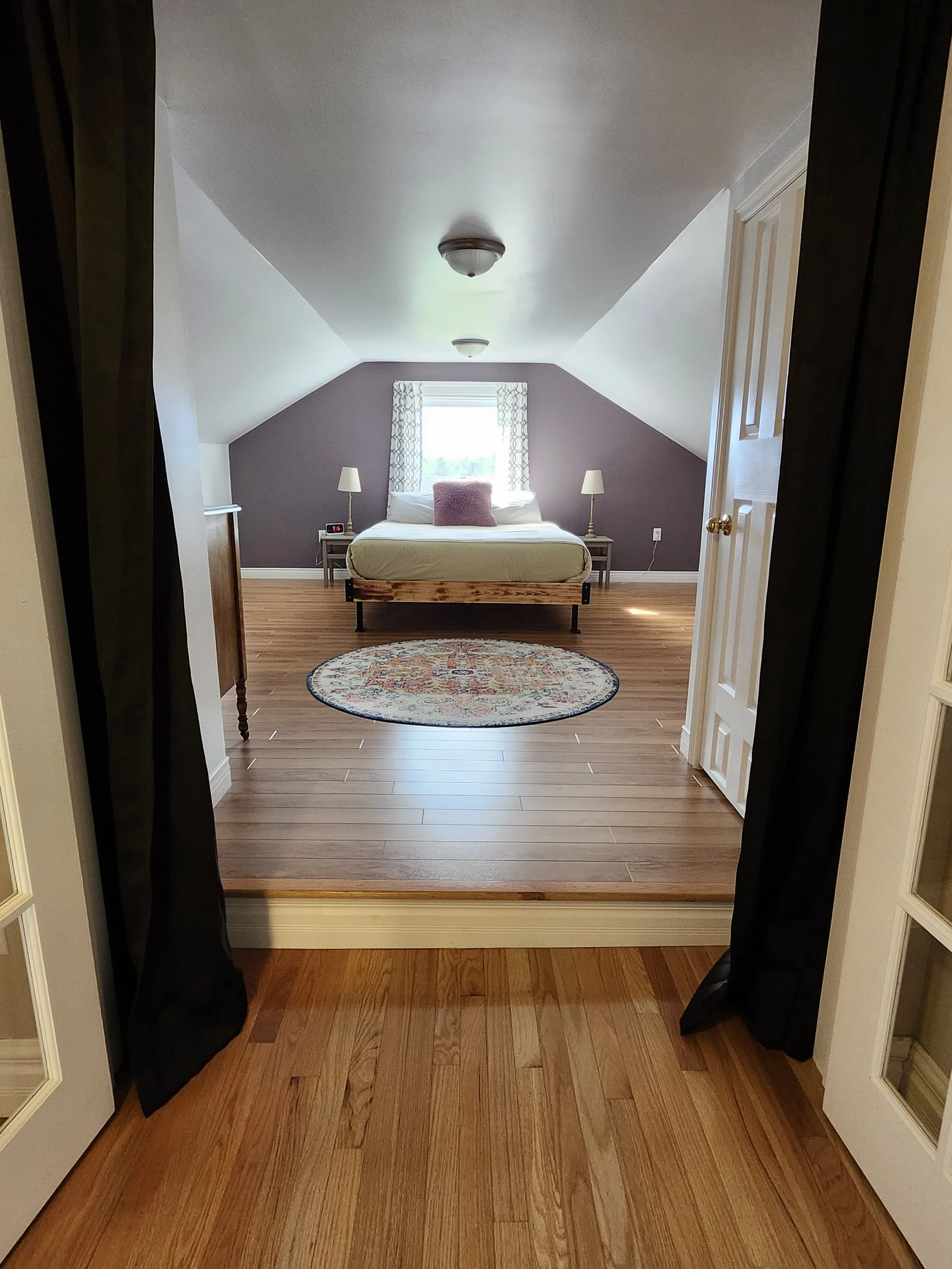 A peaceful retreat with a queen bed, soft linens, and restful charm.