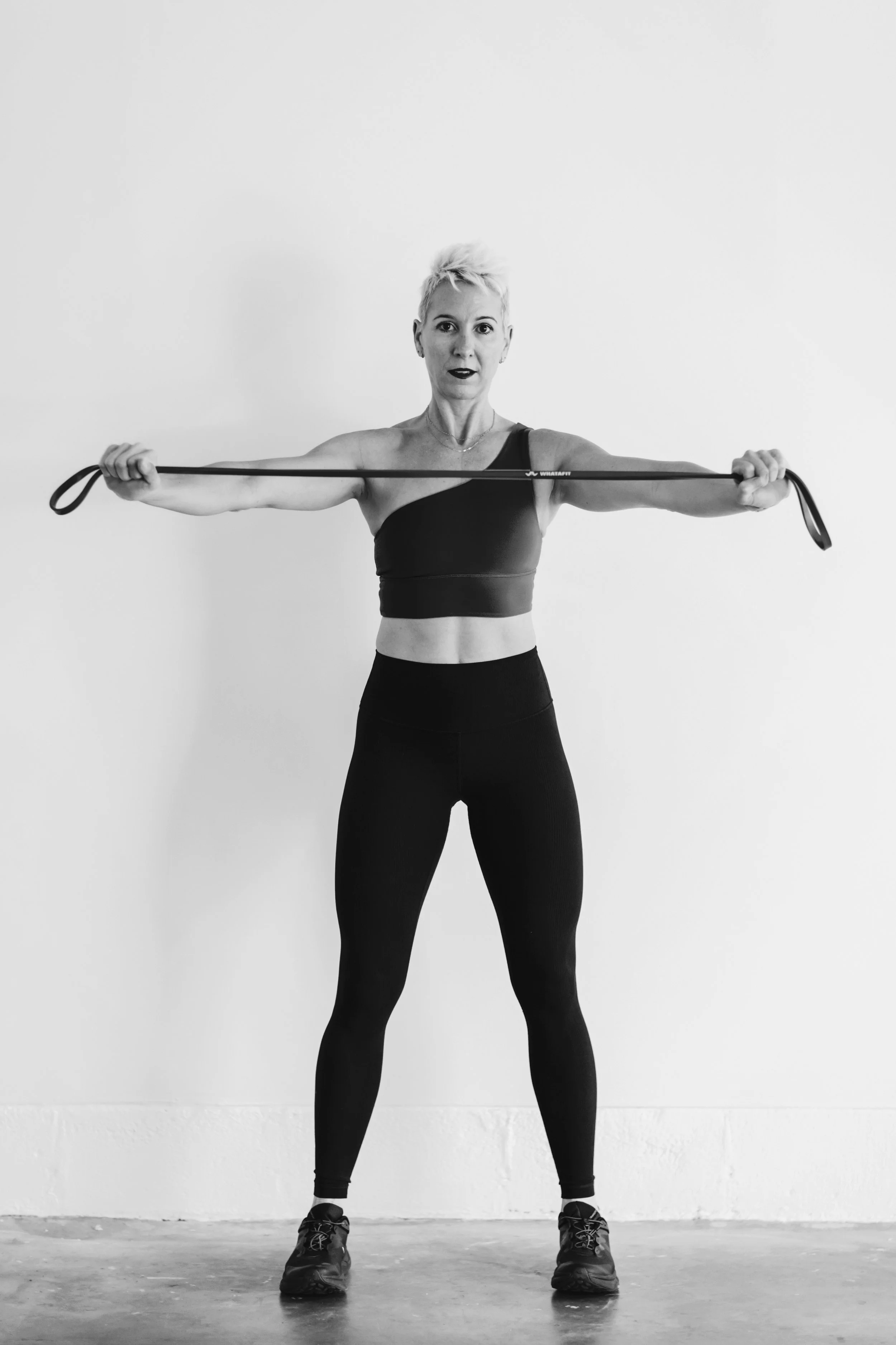 Trainer using recovery tools during strength training for women