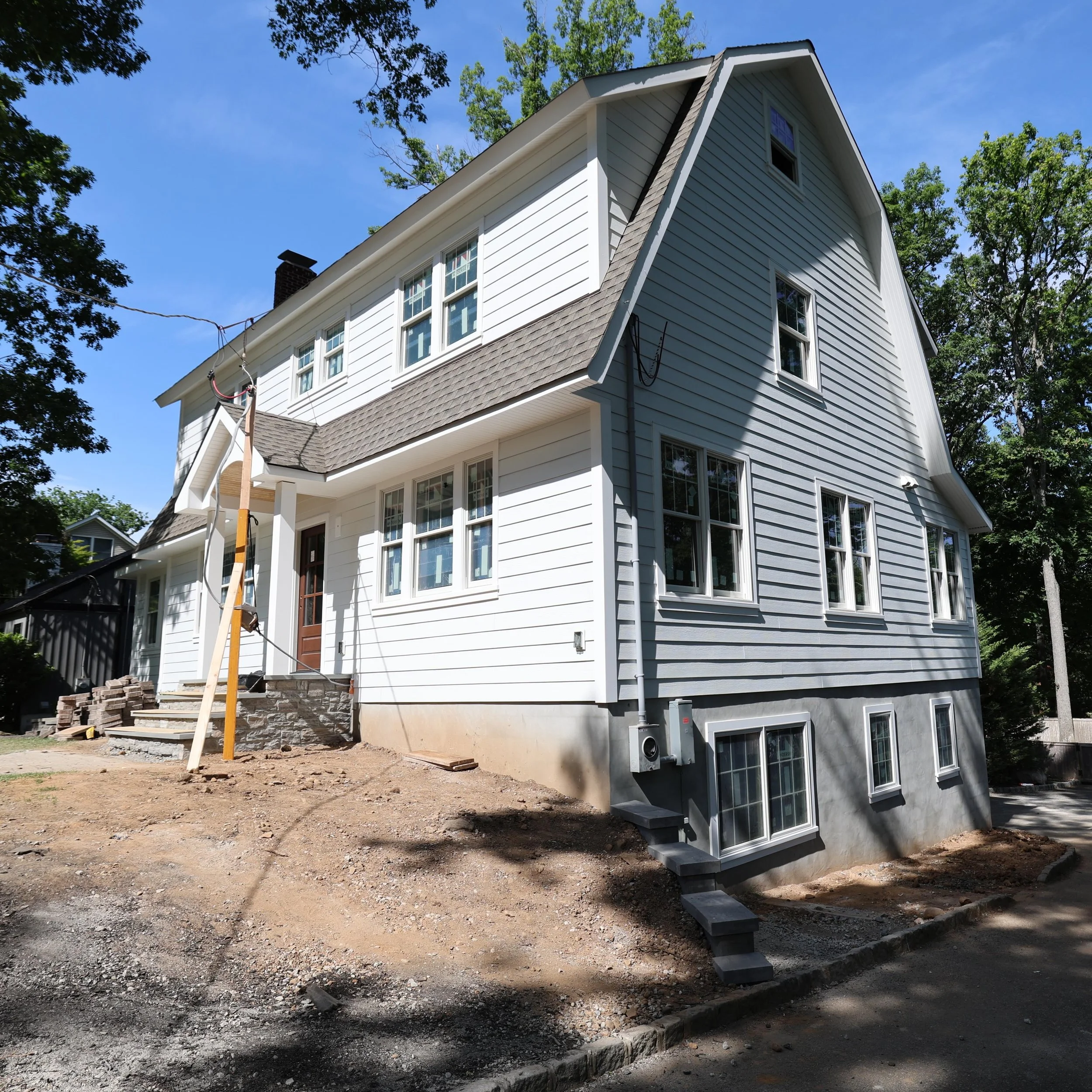 Roughly 1,200 sq ft of living space added to this home. What looked like a home cut in half is now whole. Beautiful roof lines and a classic exterior. #rottaconstruction #jameshardie #azek #customhomes #dutch