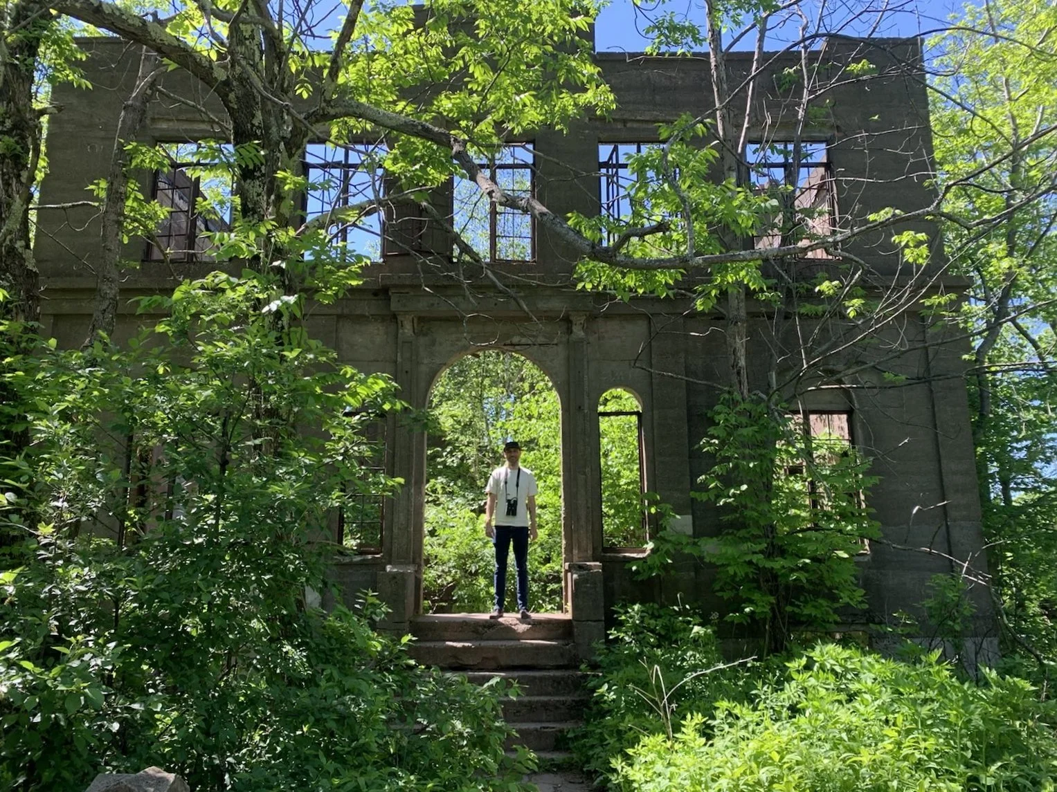 A man stands amidst the ruins of the Overlook Mountain House outside Woodstock, New York.