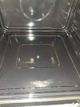 Empty microwave oven interior with a clean metallic surface.