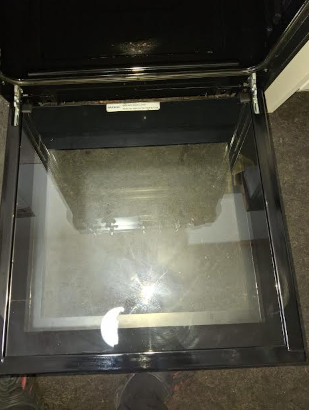 Empty glass display case or container with glass sides and black frame.