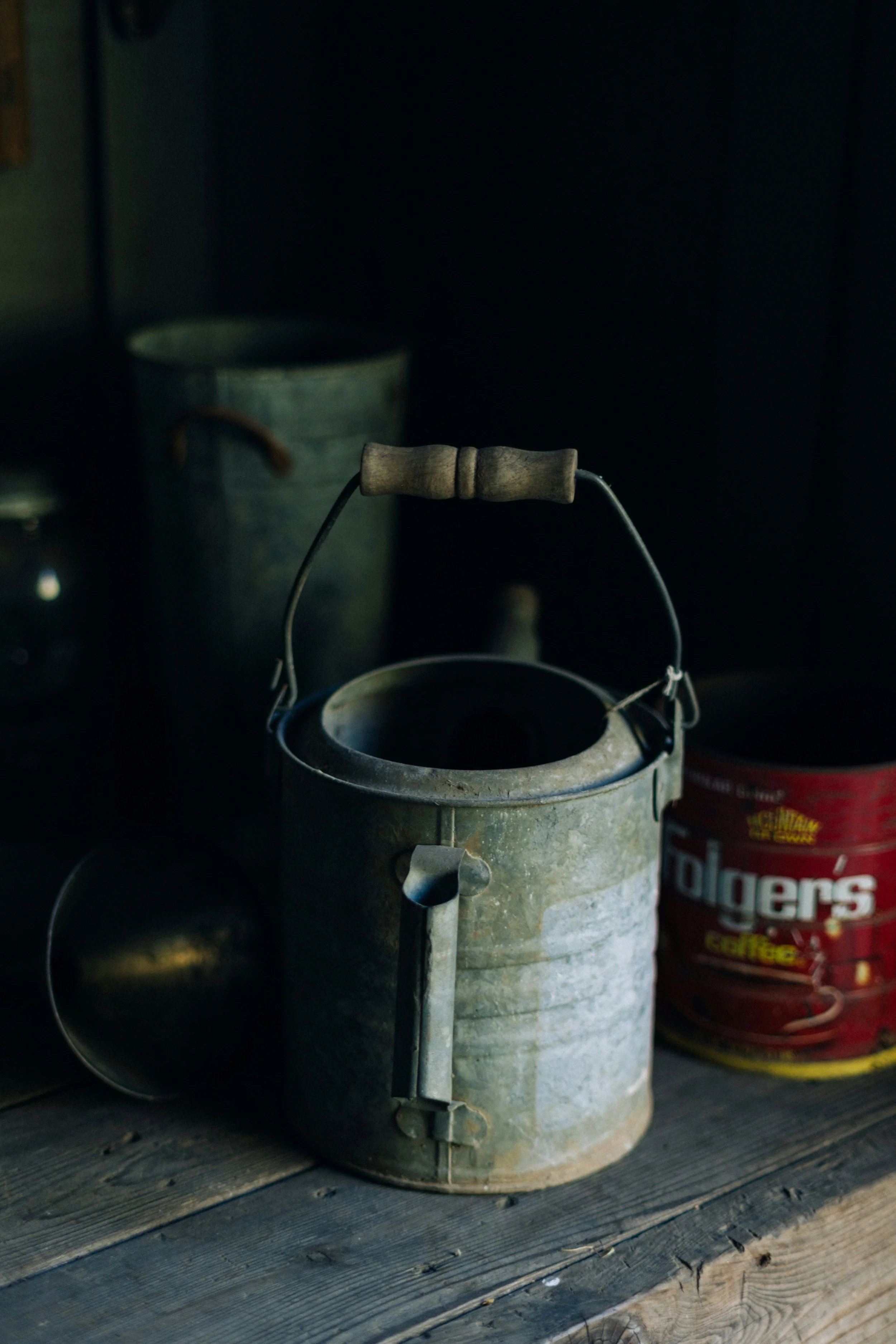 An empty weathered bucket sitting alone — a visual metaphor for emotional depletion and burnout when we have nothing left to give
