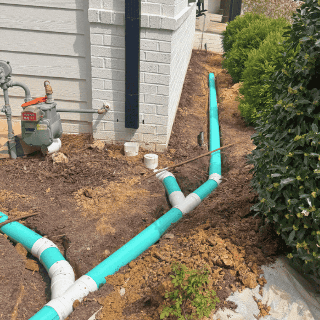 Landscaped garden bed near home steps showing drainage area conditions—runoff and yard drainage assessment in Chapel Hill, NC.