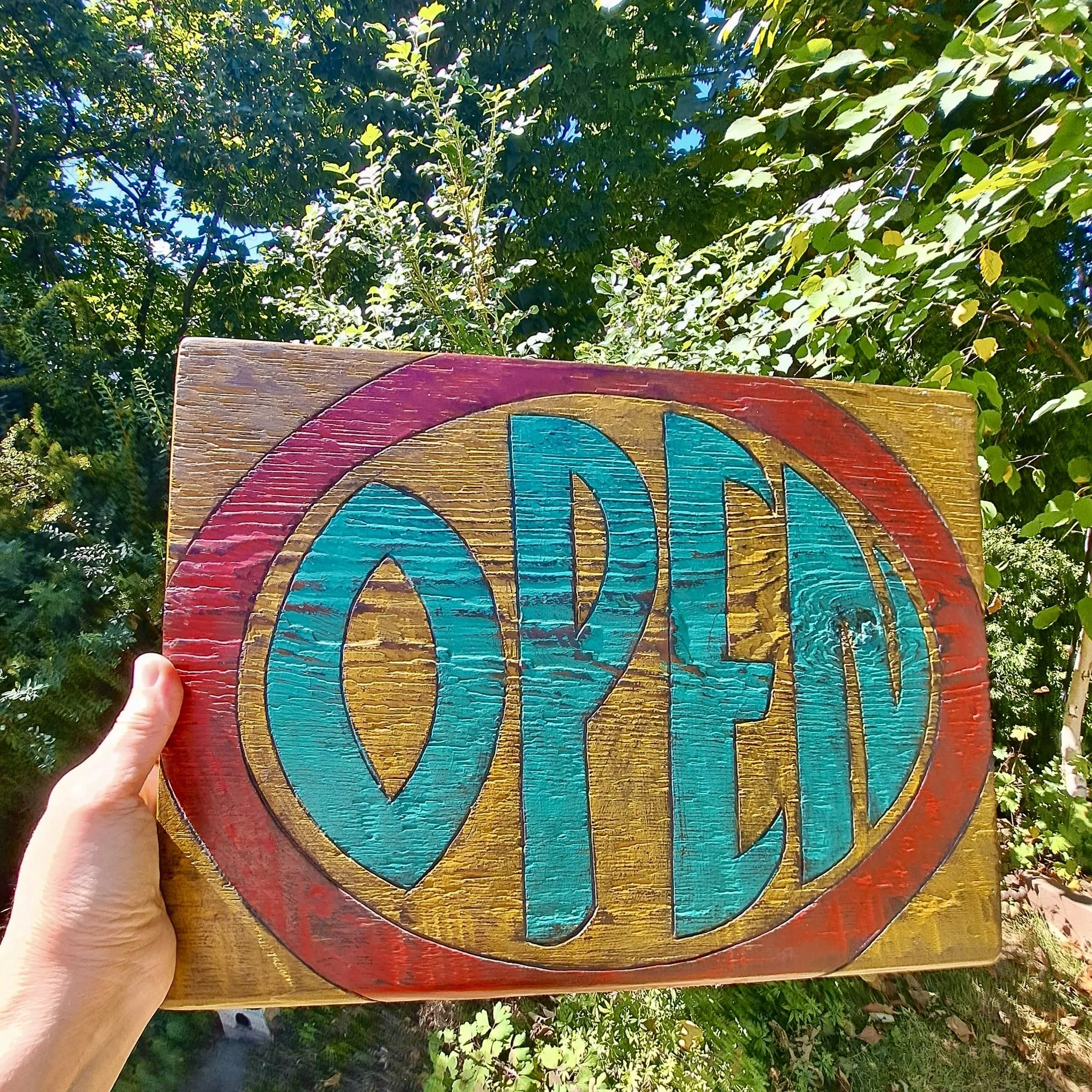 An beautiful open sign by Kelly Green that has become a Crowded Table staple - spot it at nearly every pop-up!