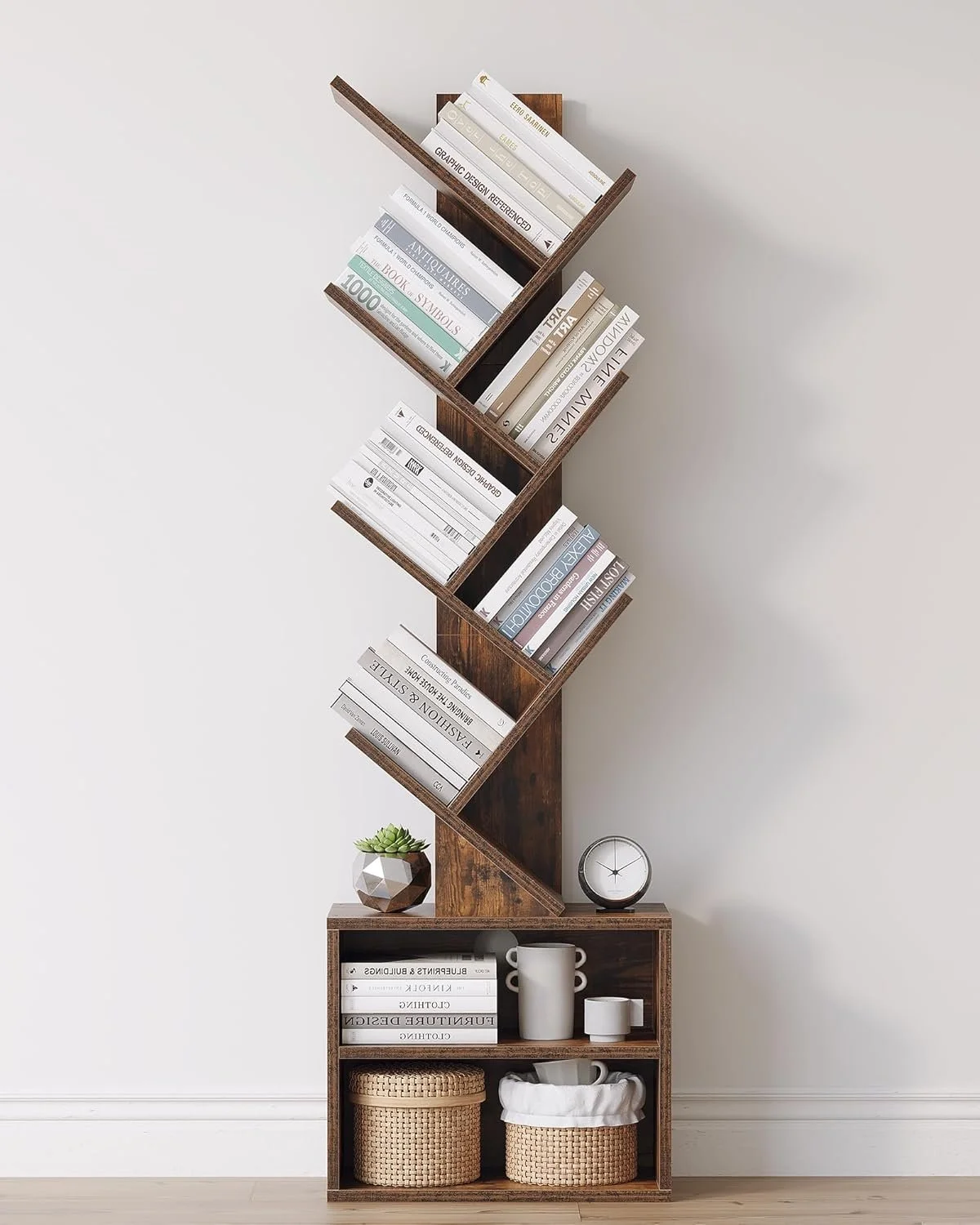 Unique zigzag wooden bookshelf with books, a small cactus, a clock, and storage baskets against a white wall.