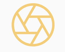 An orange graphic logo with a camera shutter design.