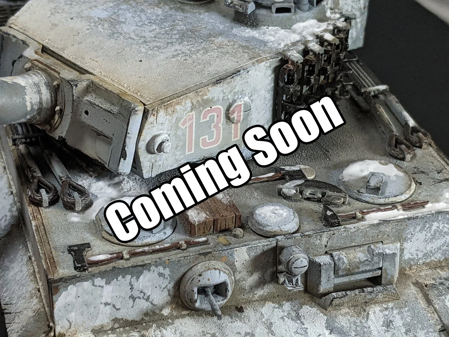 Close-up of a weathered, dusty tank or military vehicle part with the number 131 on it, showing various mechanical components, cables, and sensors, with a worn, corroded appearance.