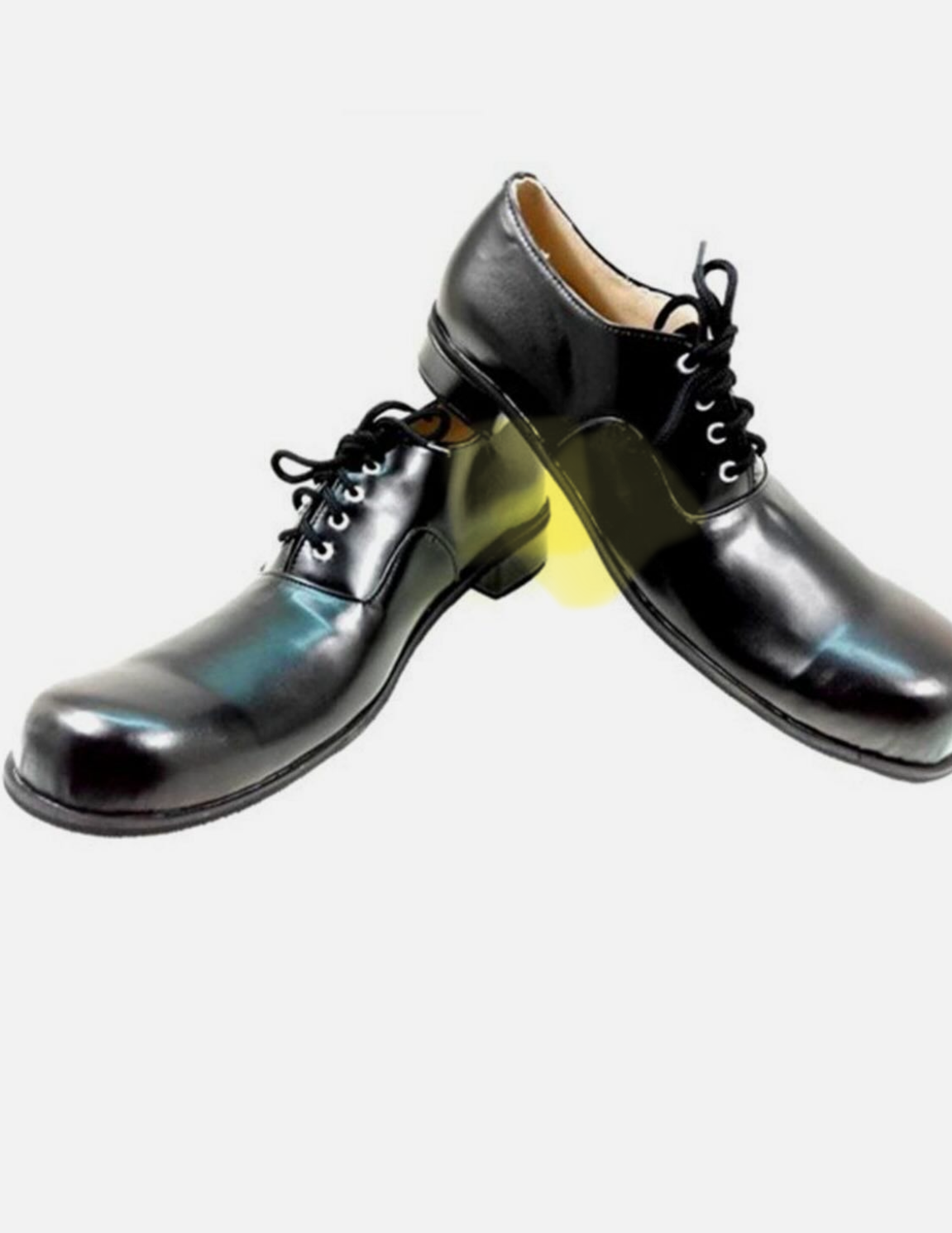 A pair of shiny black leather dress shoes with laces, placed on a white background.