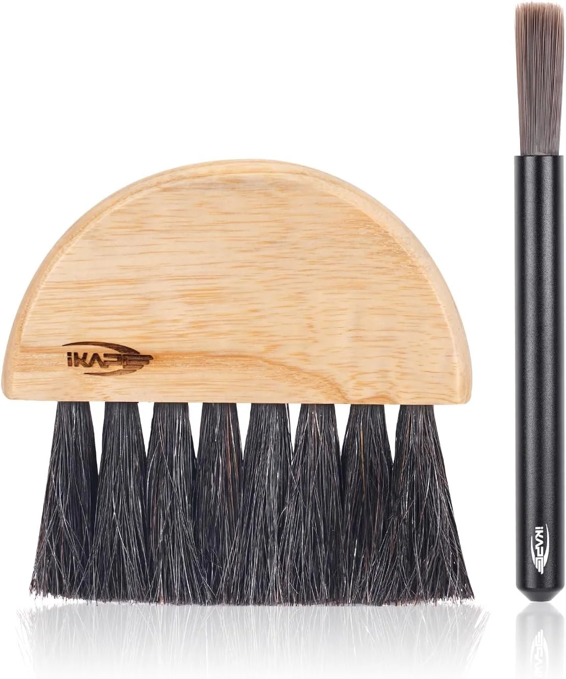 Shoe cleaning brush with black bristles and a wooden handle, along with a separate black handle tool.