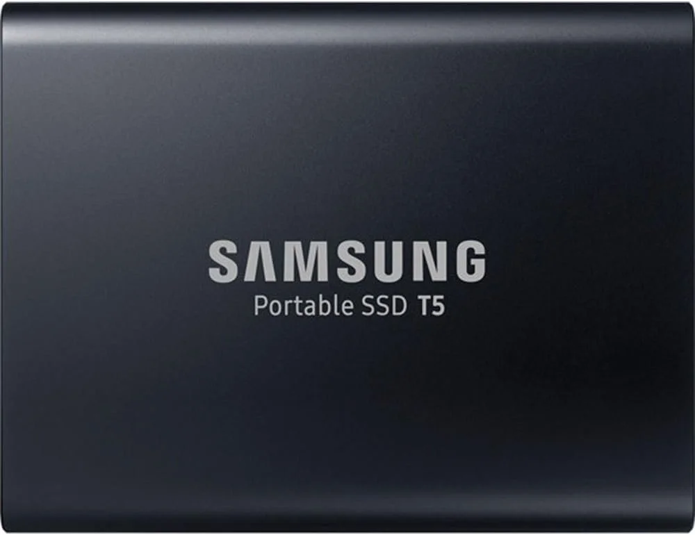 Close-up of a black Samsung Portable SSD T5 with white text in the center.