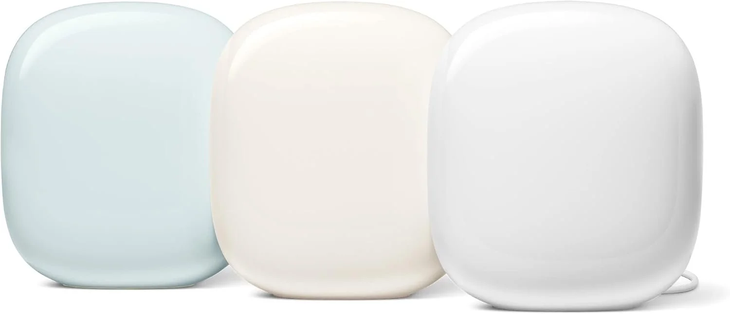 Three smart speakers in light pastel colors, arranged side by side.