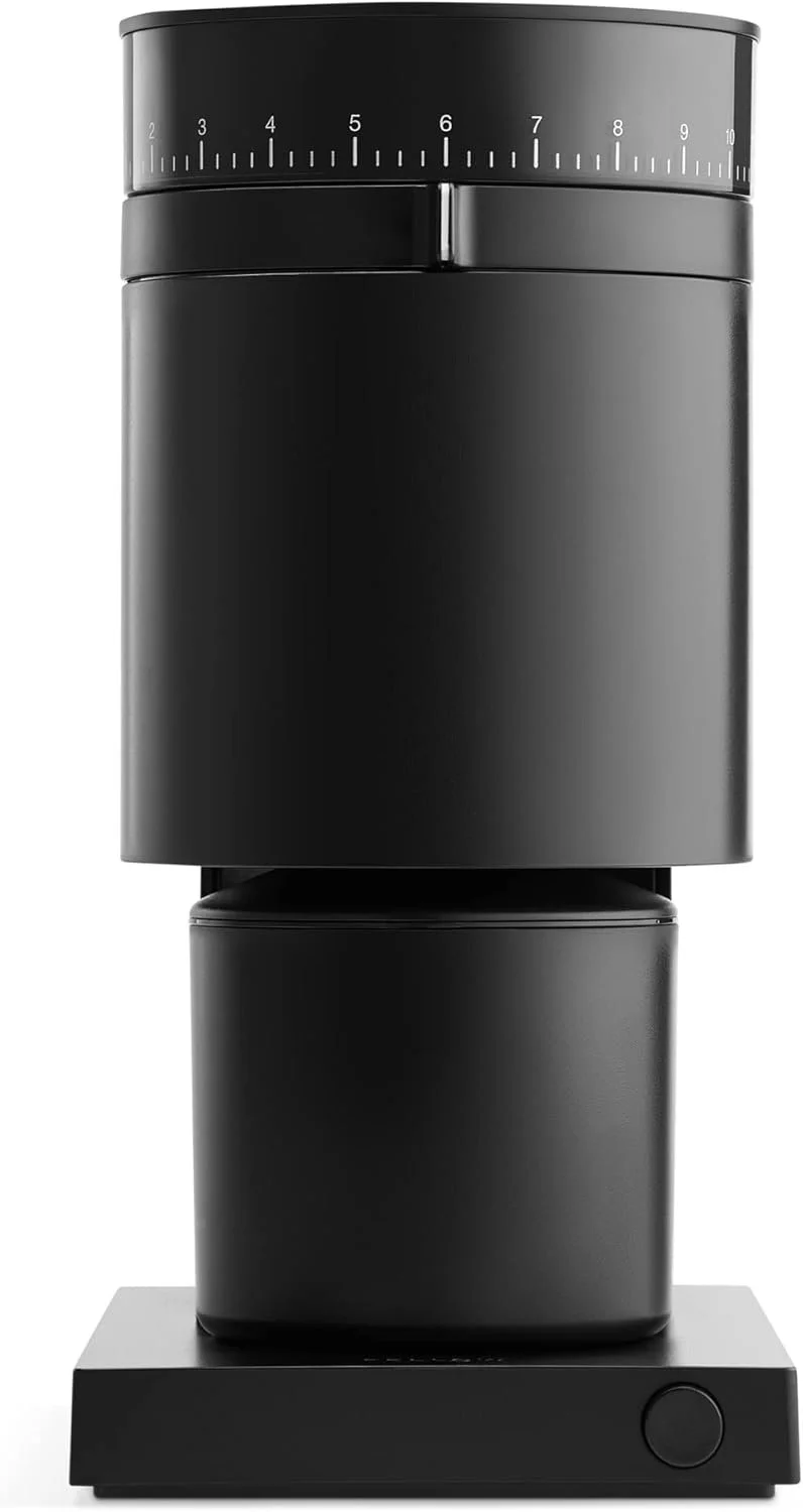 A black, modern coffee grinder with a measurement scale on top and a circular control button on the base.