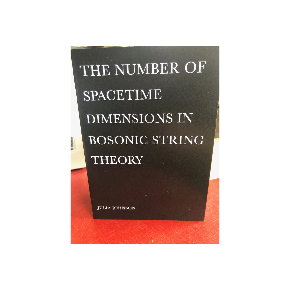 The Number of Spacetime Dimensions in Bosonic String Theory