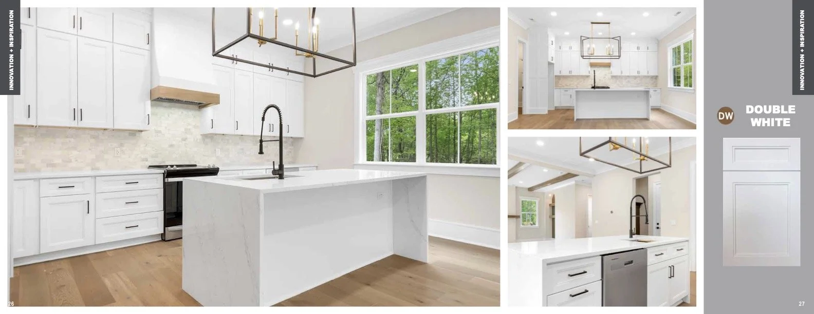 Bright and modern kitchen with white cabinets, a large center island with a white countertop, a black faucet, and a black range. Large windows overlook a lush green forest, allowing natural light into the space. The kitchen features sleek, minimalist