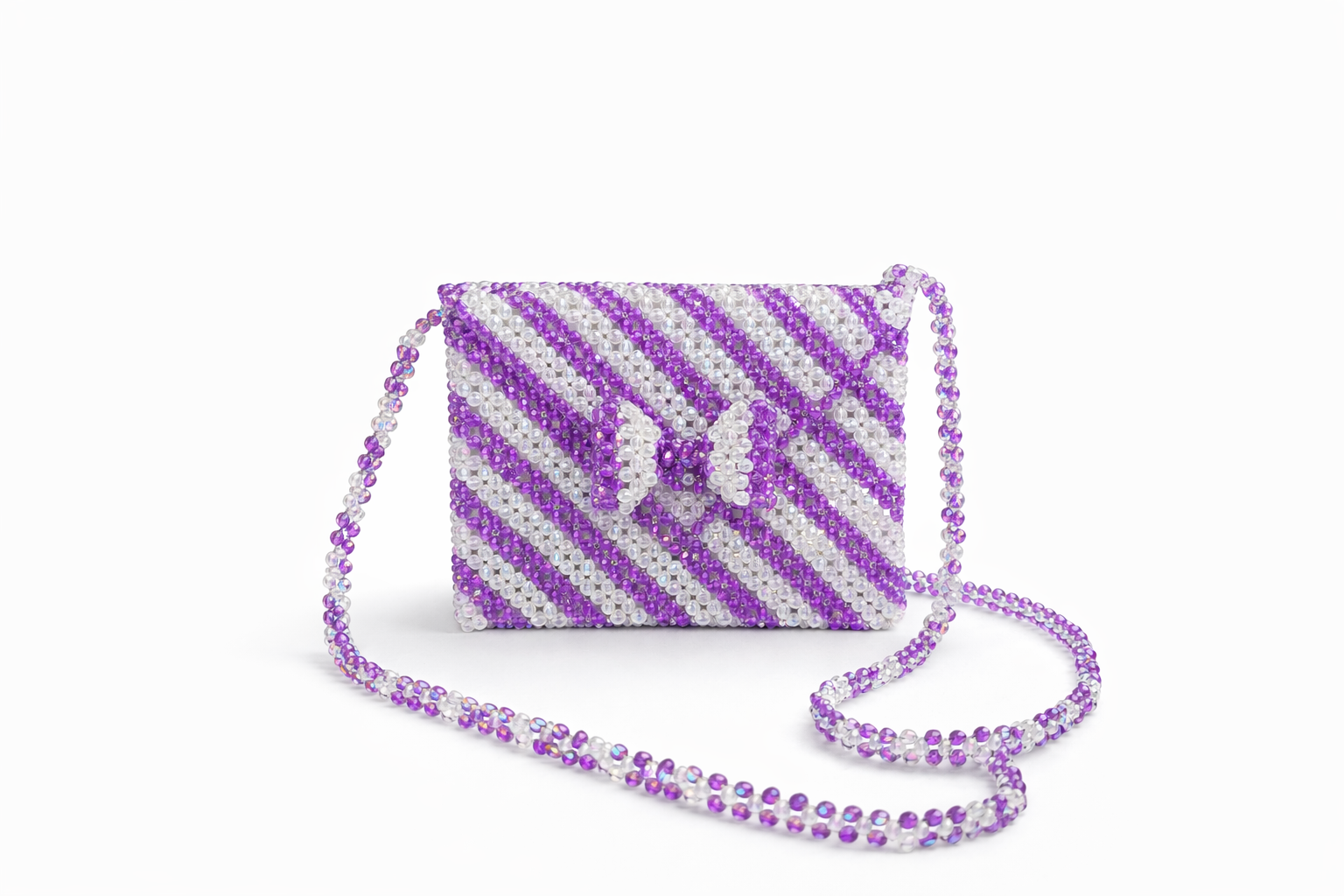Beaded purple handbag with bow design.png