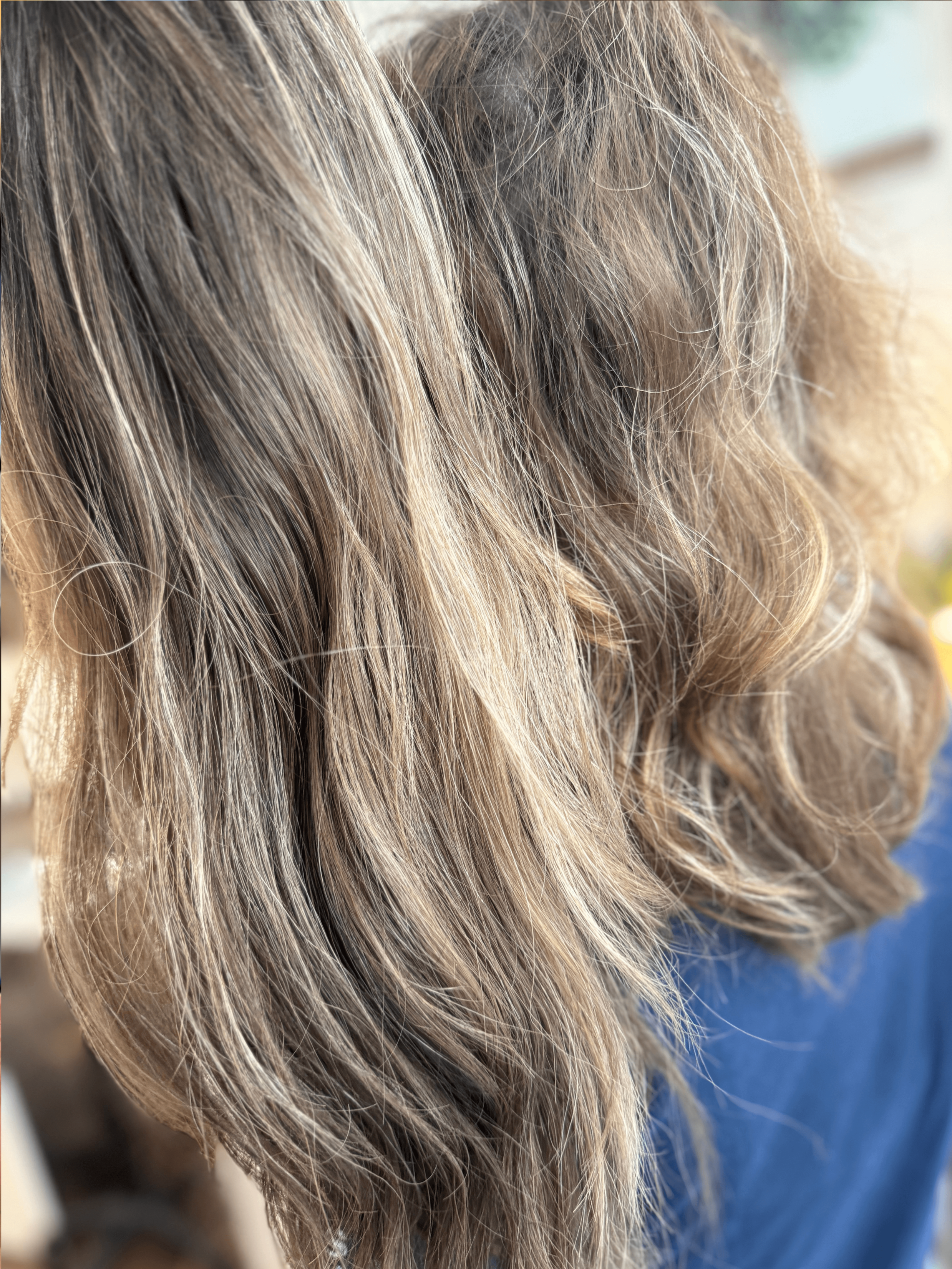 Hair topper color and style matching with a client's natural hair by Board-Certified Trichologist Suzi Watkins at Suzi Loves Hair Root Revival Salon in Cumming, GA, demonstrating a seamless blend for hair thinning and hair loss.