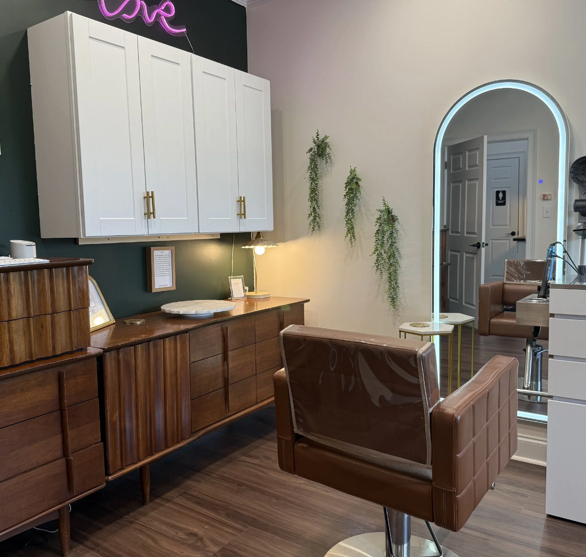 “Client seated in a private treatment suite at Root Revival Hair Restoration during a hair and scalp analysis assessment"