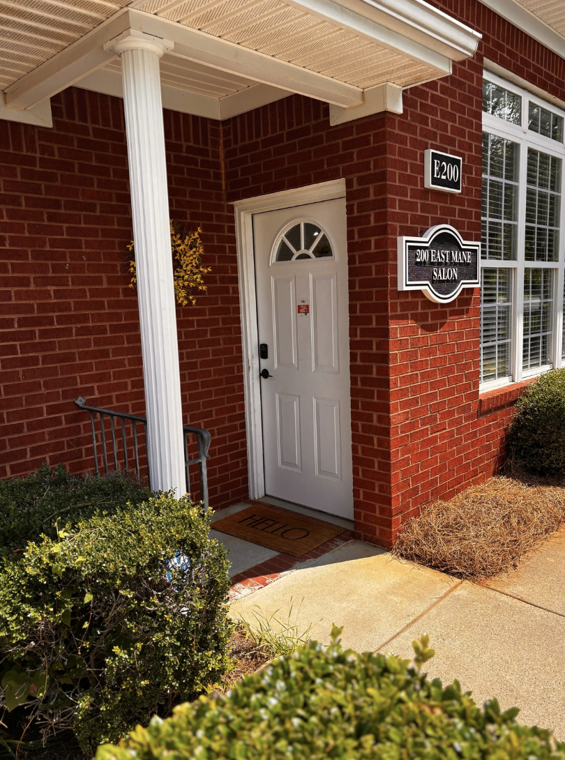 “Salon entrance to Root Revival Hair Restoration, a professional hair restoration clinic offering trichology and scalp health services”