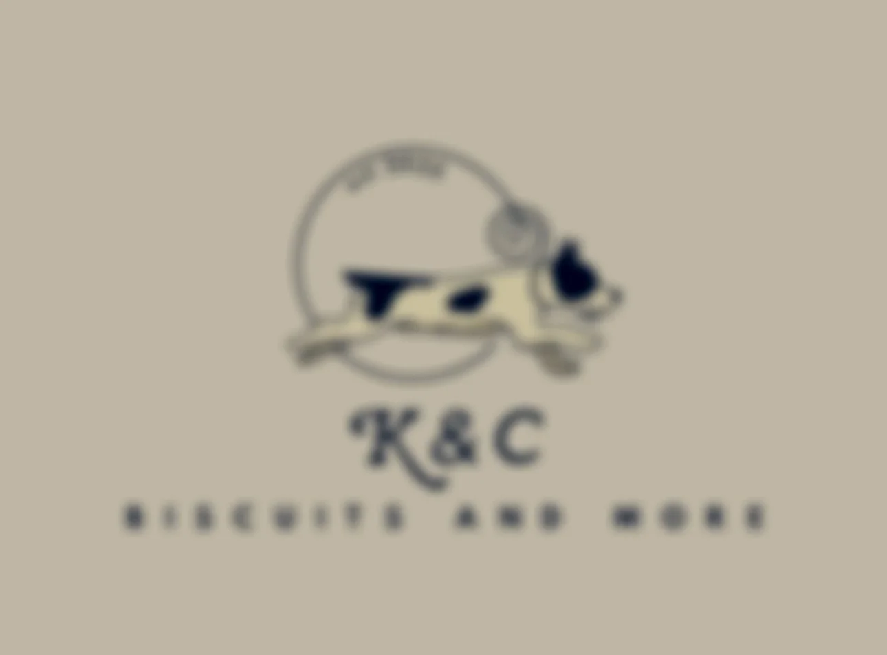 A blurred logo featuring a dog leaping through a hoop, with the letters 'K & C' and the slogan 'Biscuit's Are Gone' beneath.