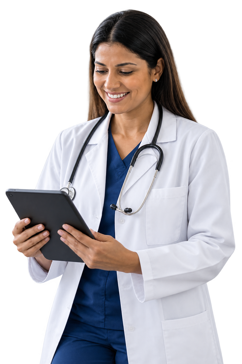 A female doctor with dark hair, wearing a white coat, blue scrubs, and a stethoscope around her neck, looking at a tablet and smiling.