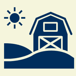 A barn on a farm with a sun shining in the sky.