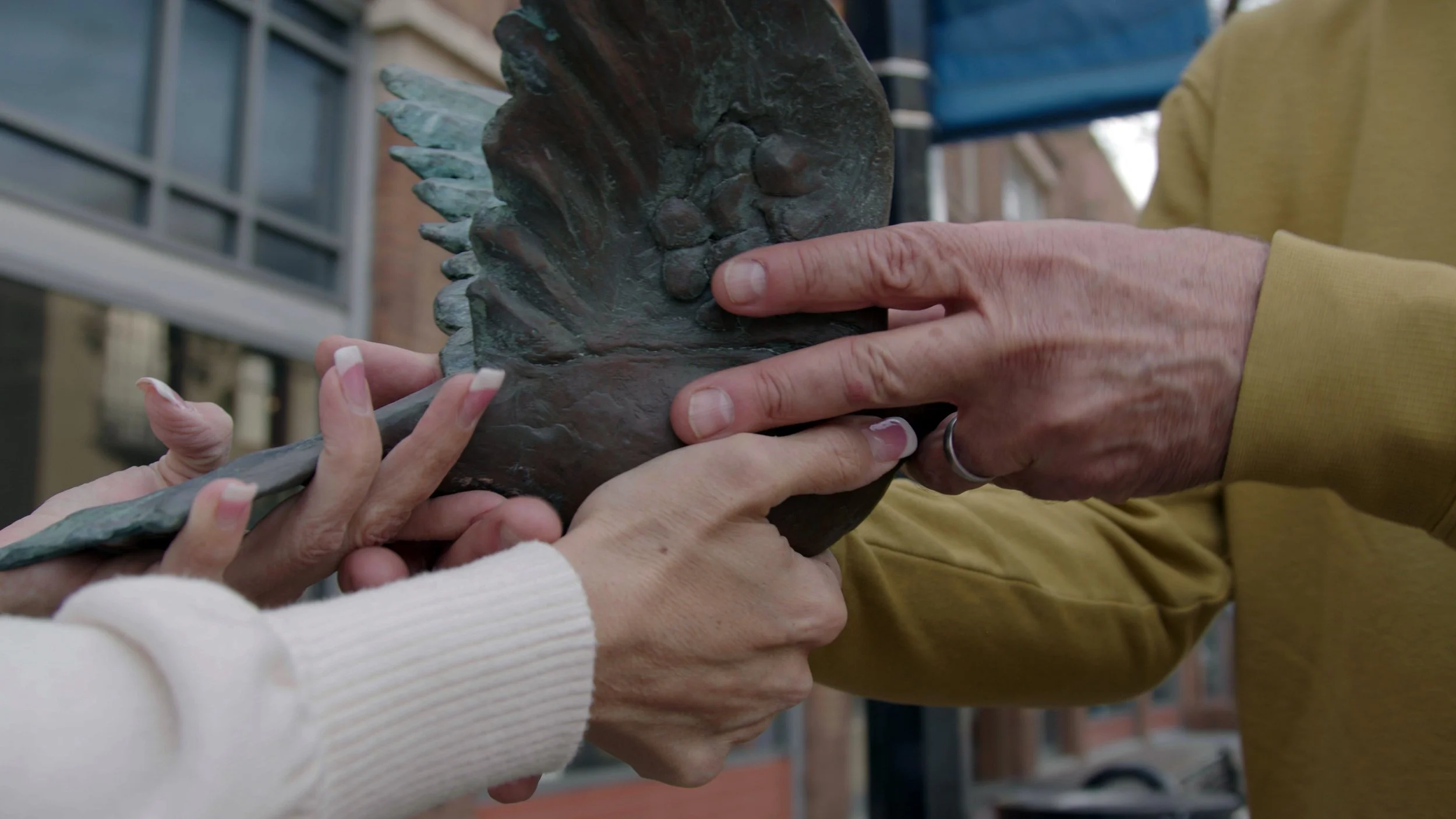 John handover with dove in front of GCAC.jpg