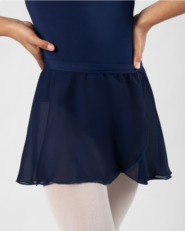 A person wearing a navy blue athletic skirt with a sheer overlay and beige tights.