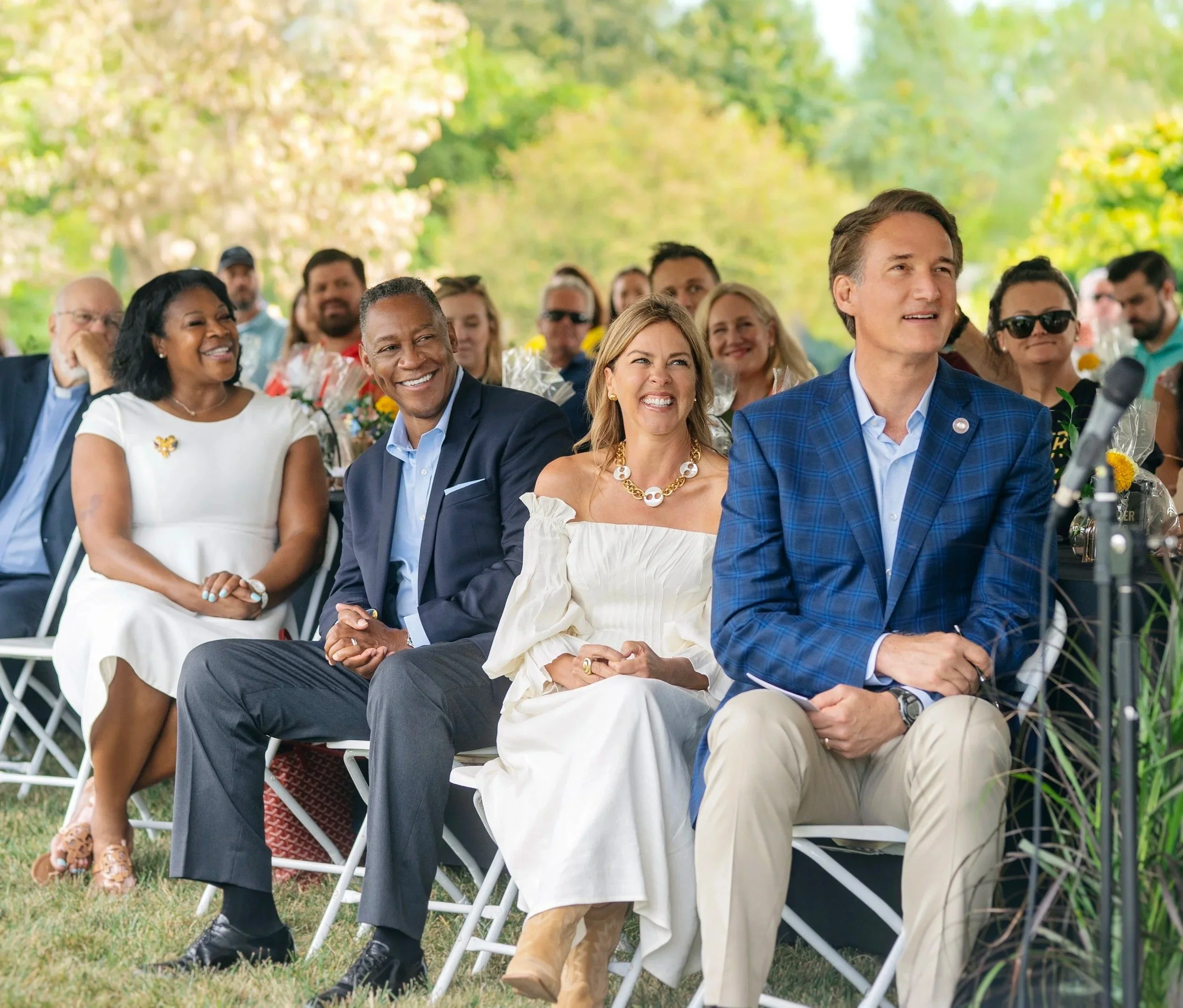 people sitiing on chiers in a wedding