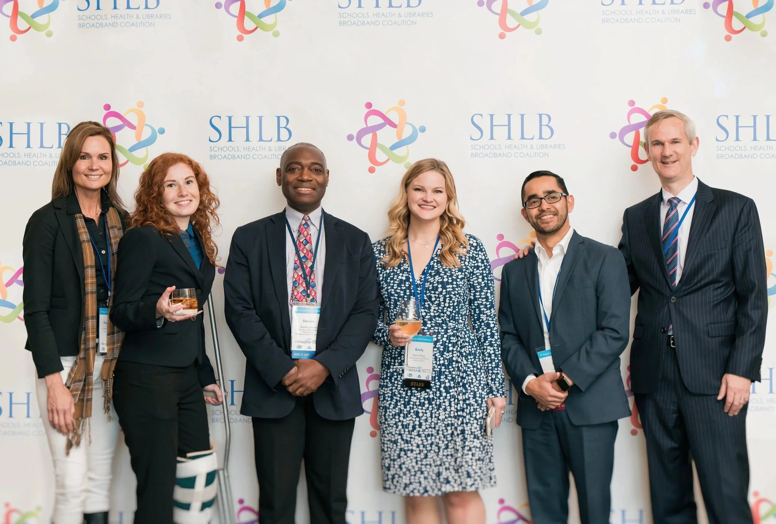 panel posing at an event