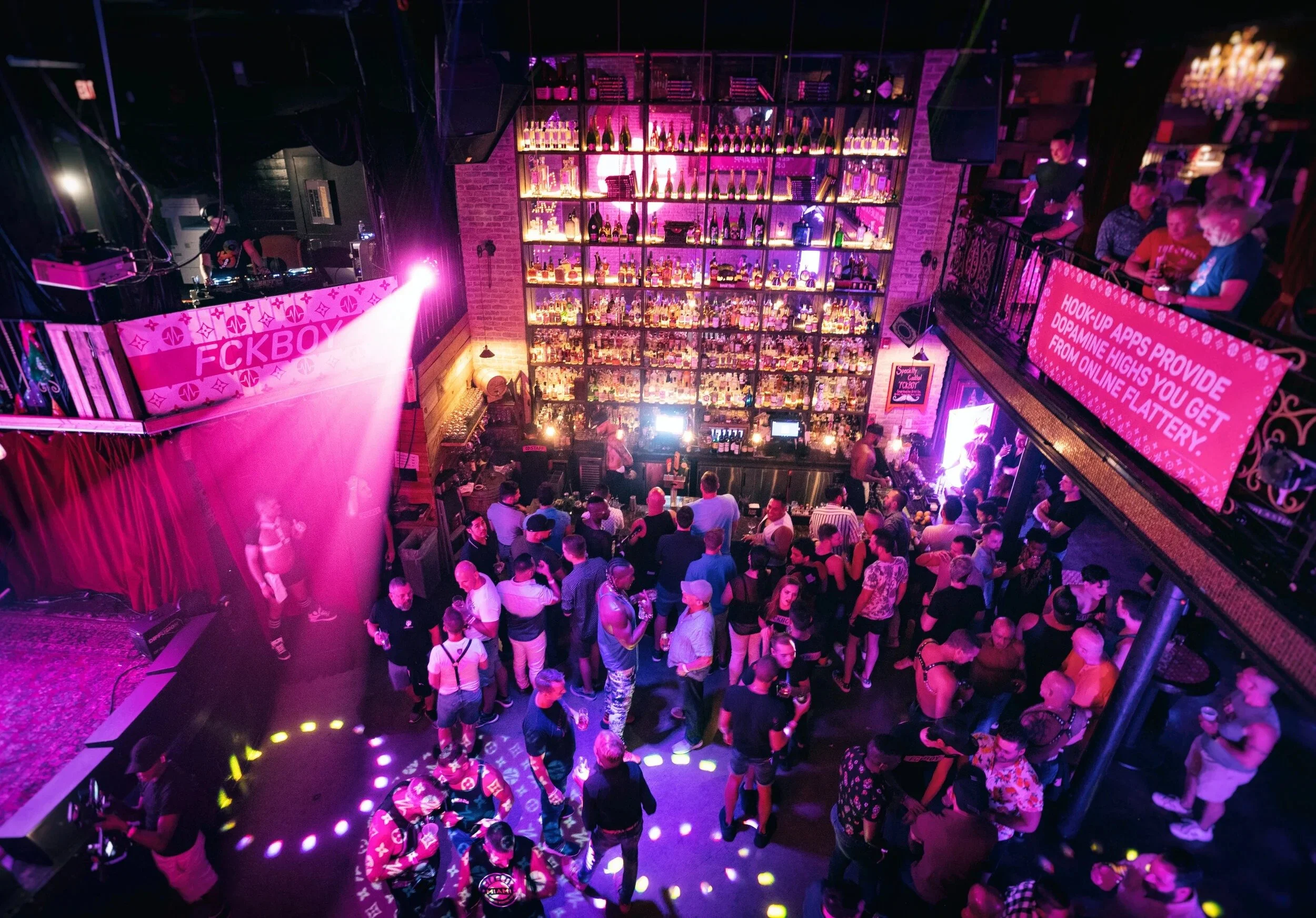 seen of a bar from top where people are dancing