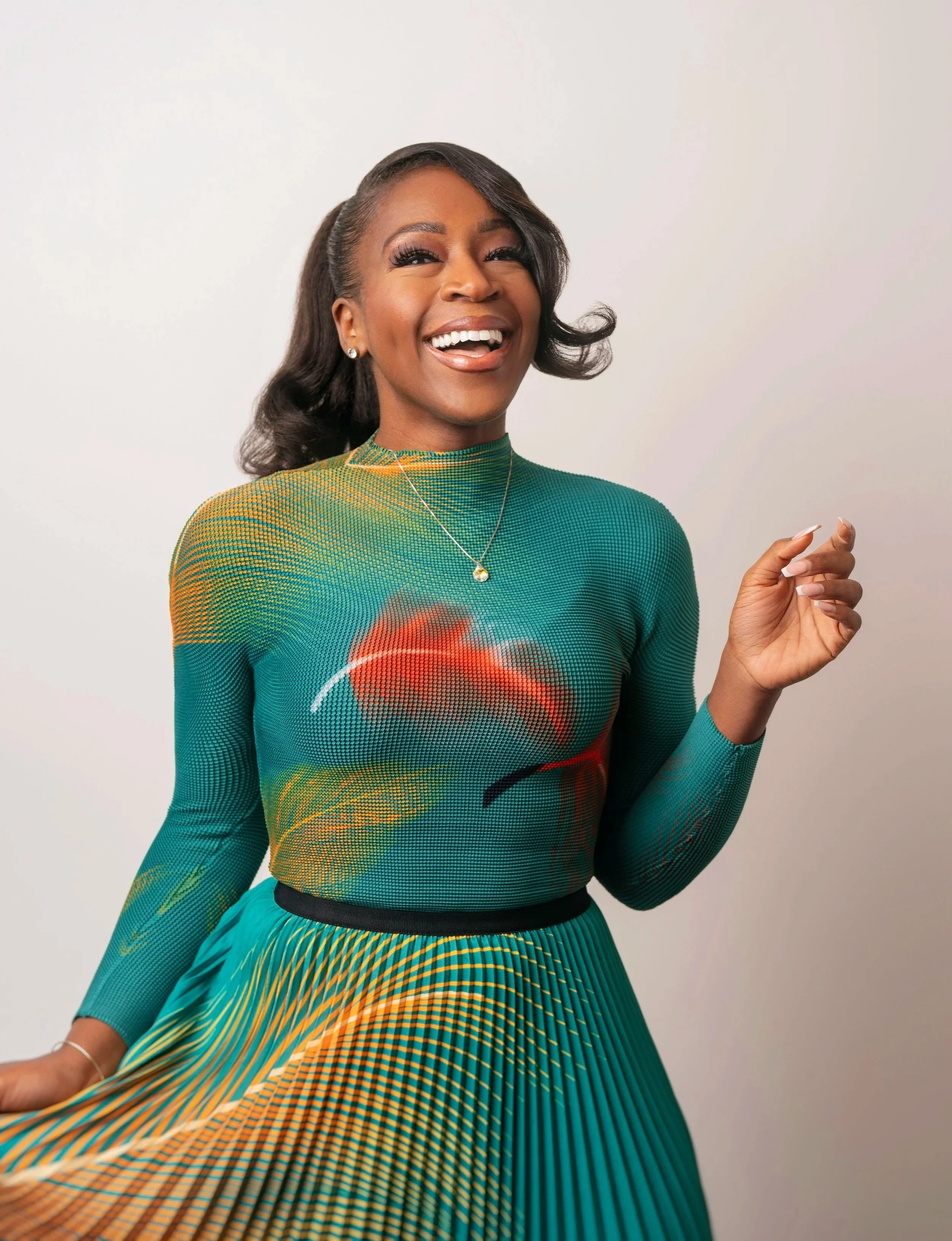 woman with green dress laughing