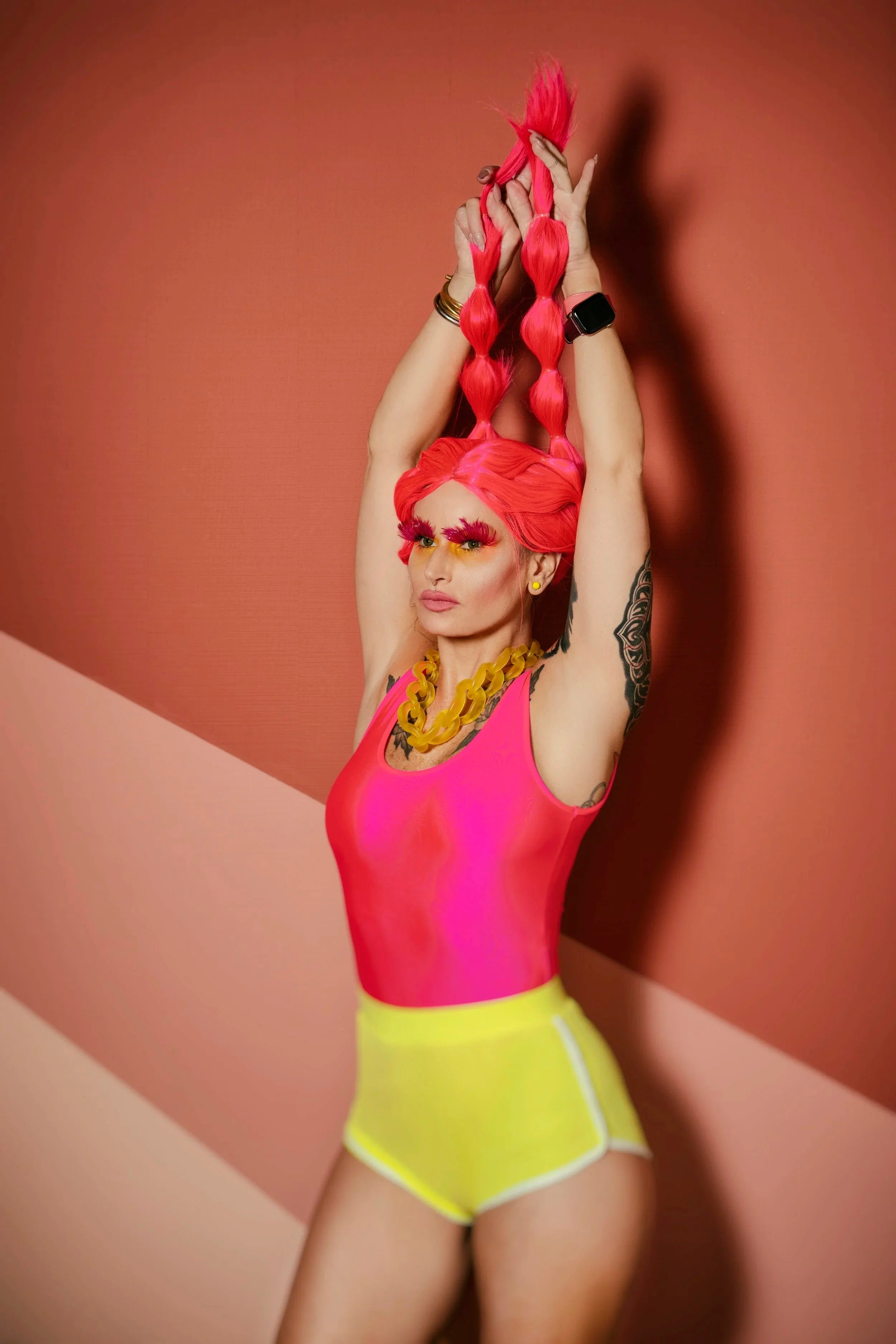 woman wearing neon dress for a photoshoot
