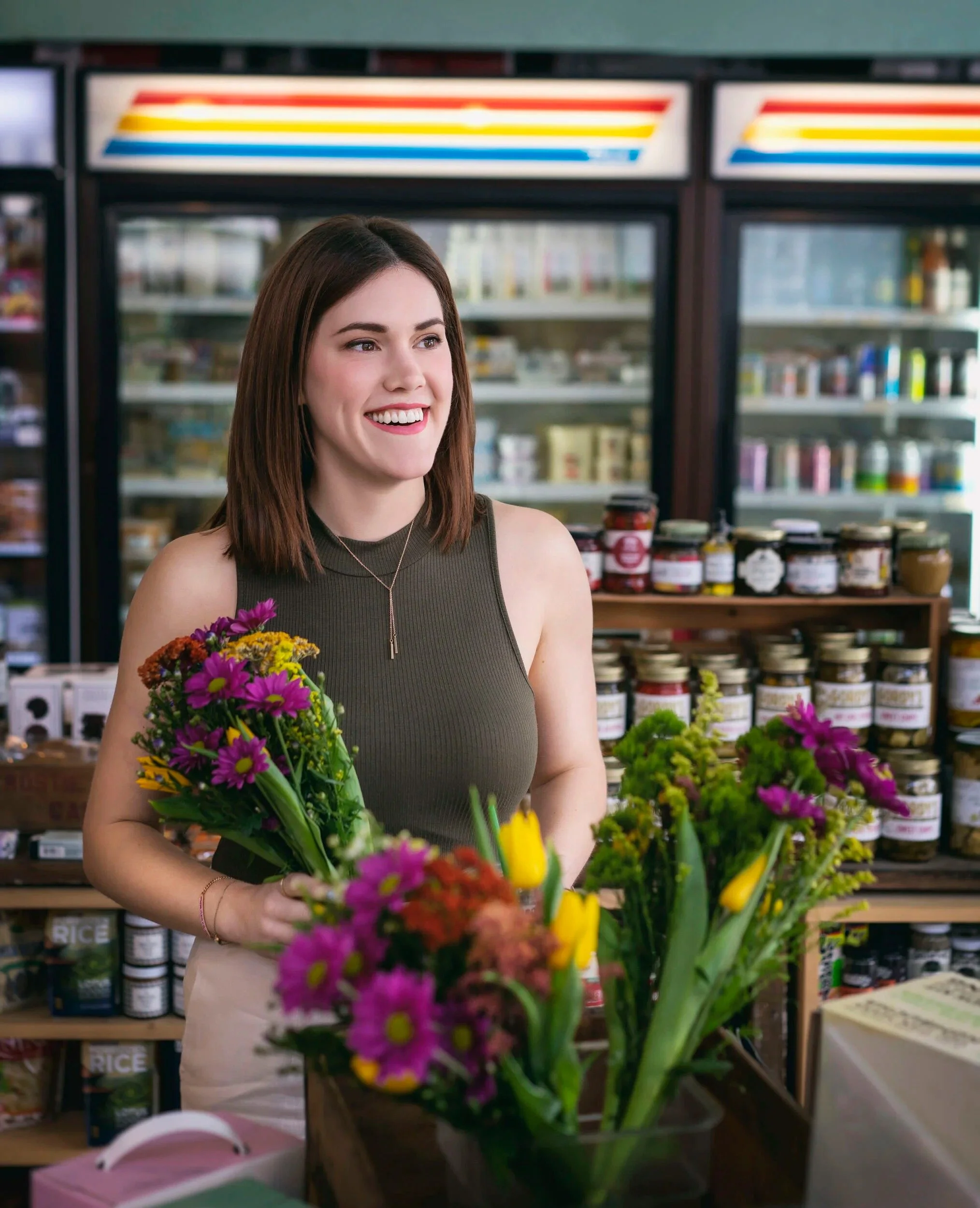 Beautiful woman carrying flowers