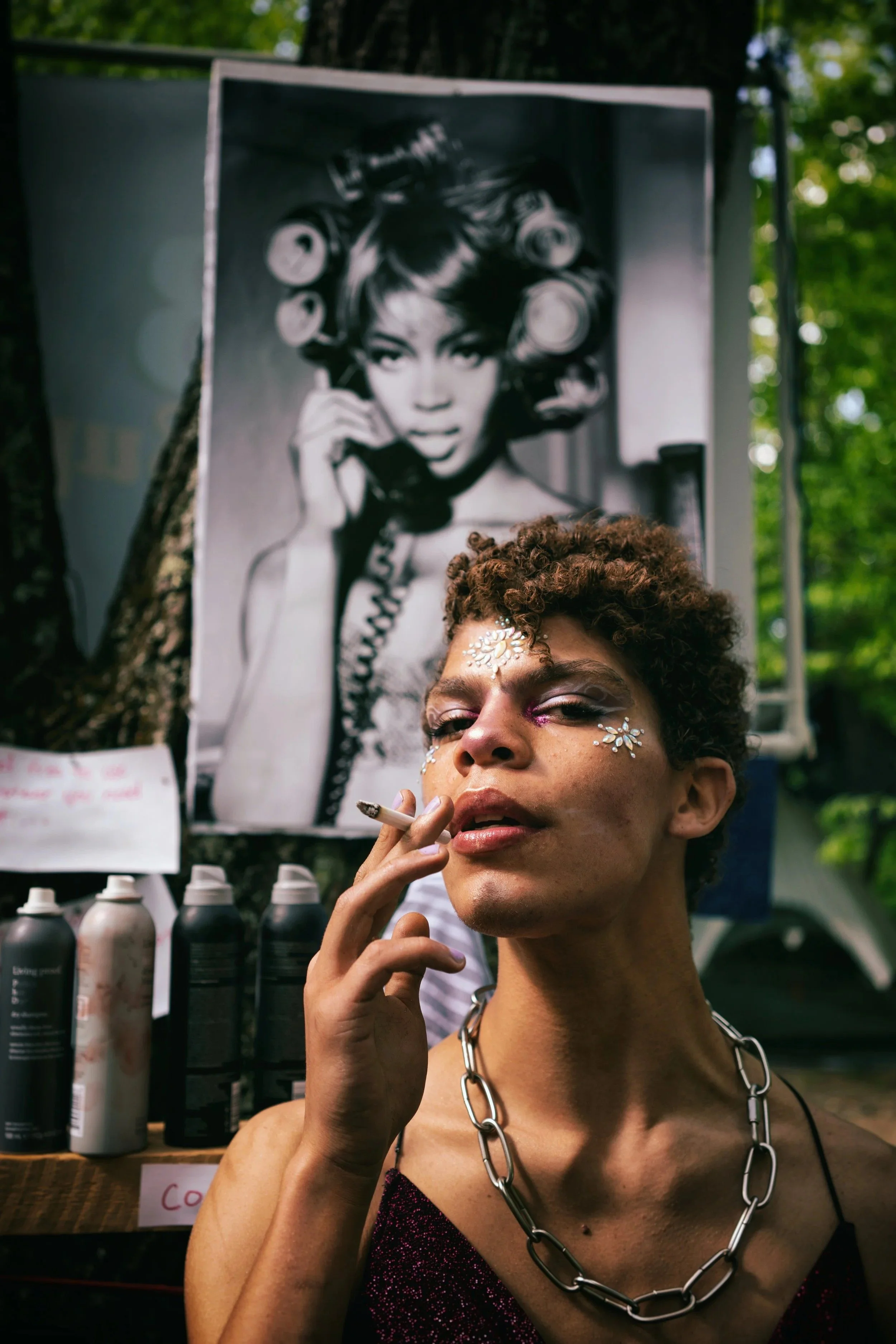 person holding a cigar acting like smoking it.