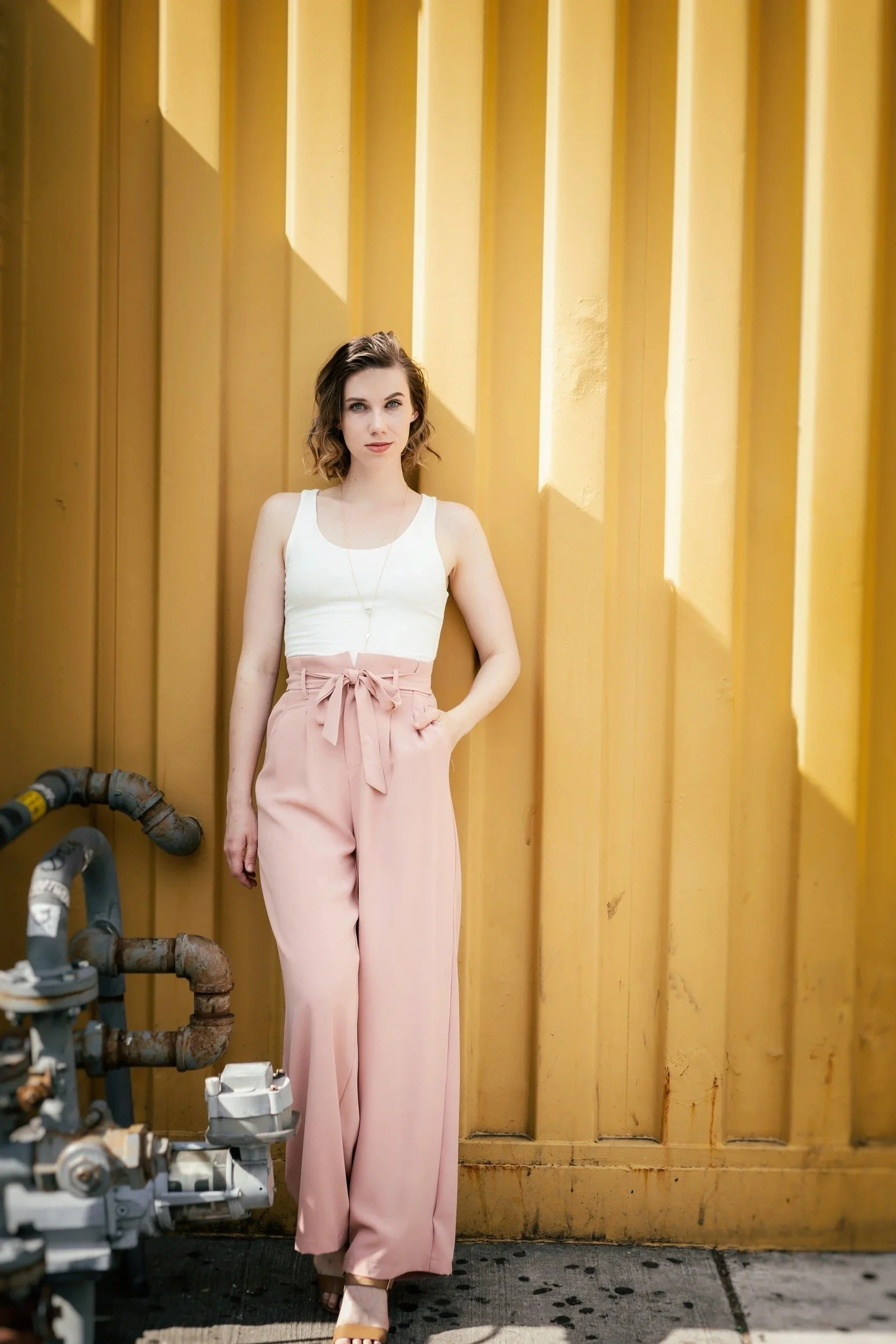 woman standing in front of a wall in San Francisco for a photoshoot