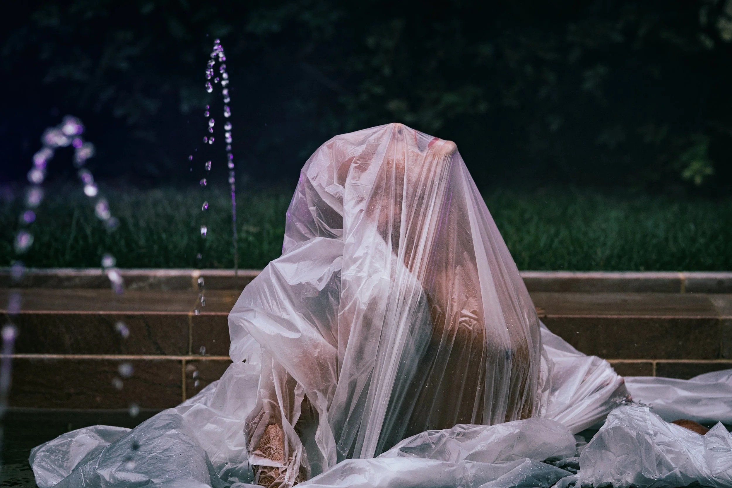 naked woman coming out of thin white sheet