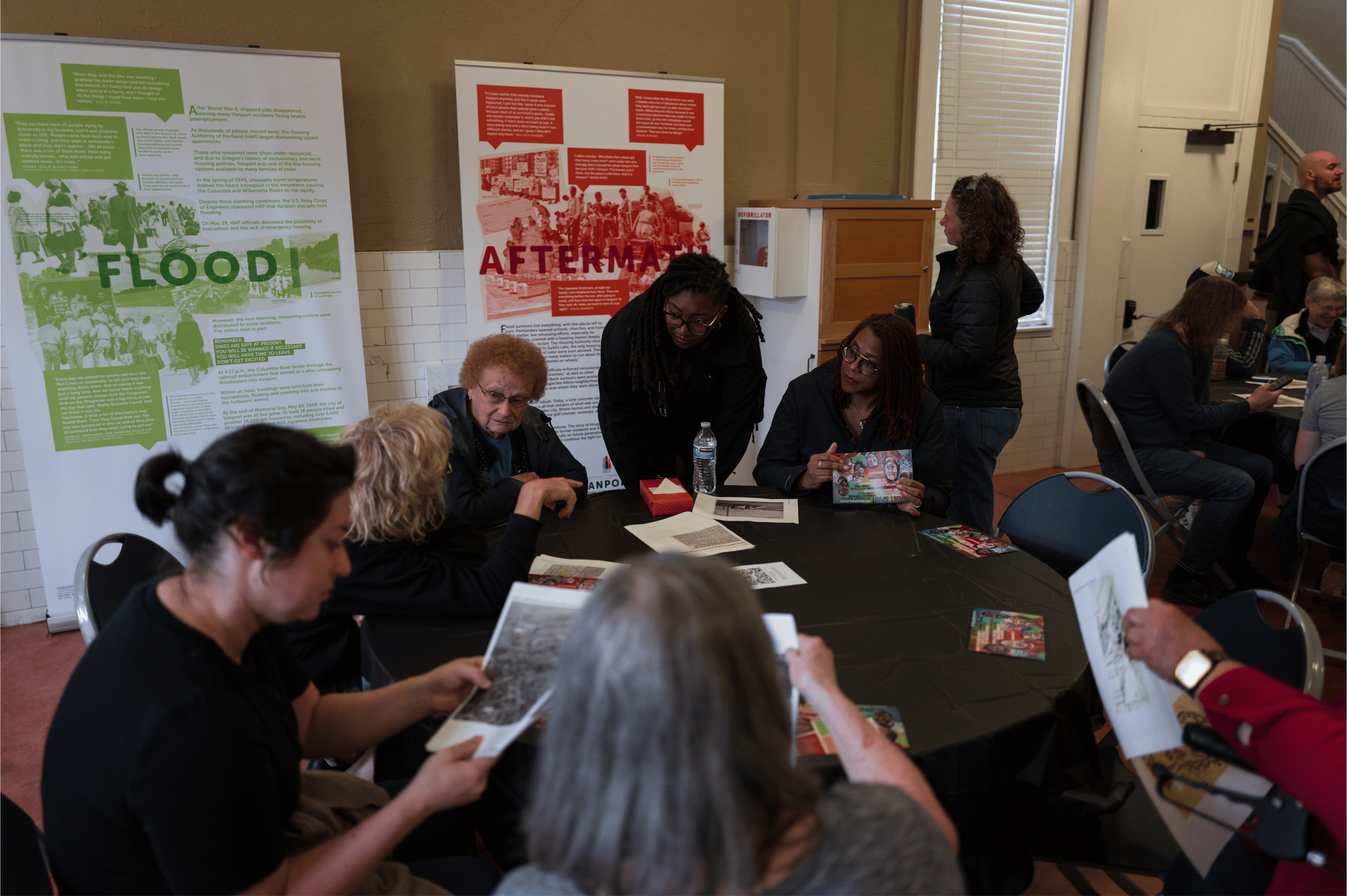  Participants engaging with historical exhibits and archival materials at the Kenton Historic Firehouse during Kenton Roots on September 12, 2026.  Photo: Troy Winslow / Vanport Mosaic.  