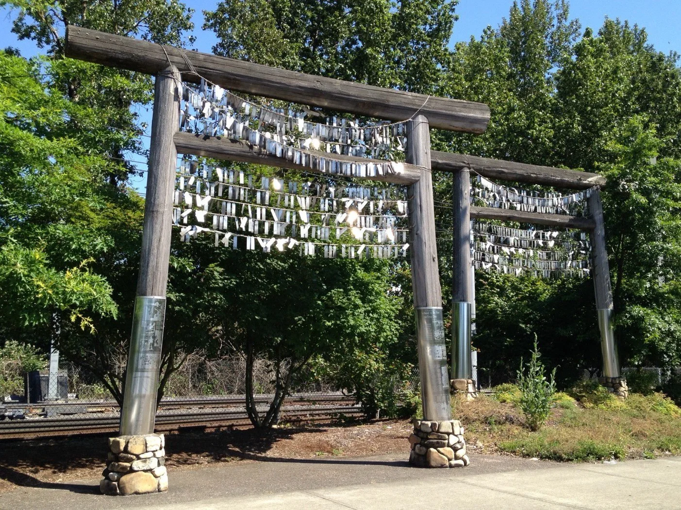 Toro-style wooden structures with rows of ropes where metal tags are hanging.