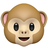 Close-up of a monkey face emoji with large eyes and cheerful expression