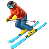 Person skiing downhill with goggles and winter clothing