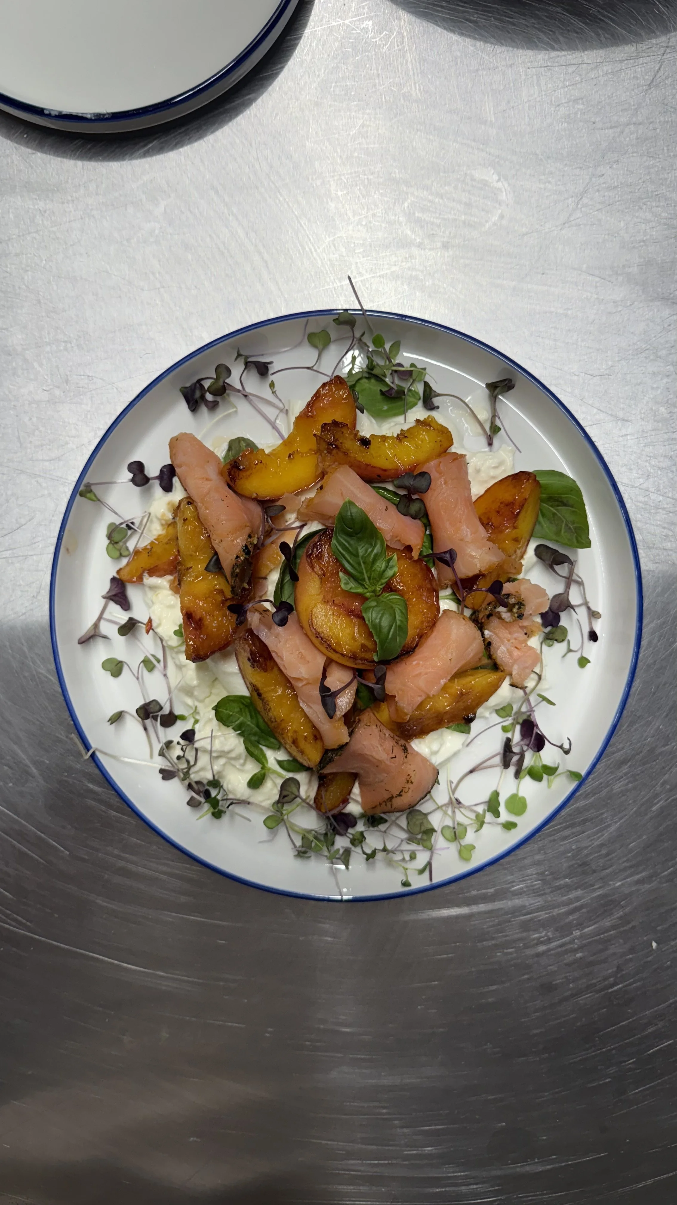 Peach-forward seasonal dish delicately plated as part as a seasonal dining experience by Chino Angles.
