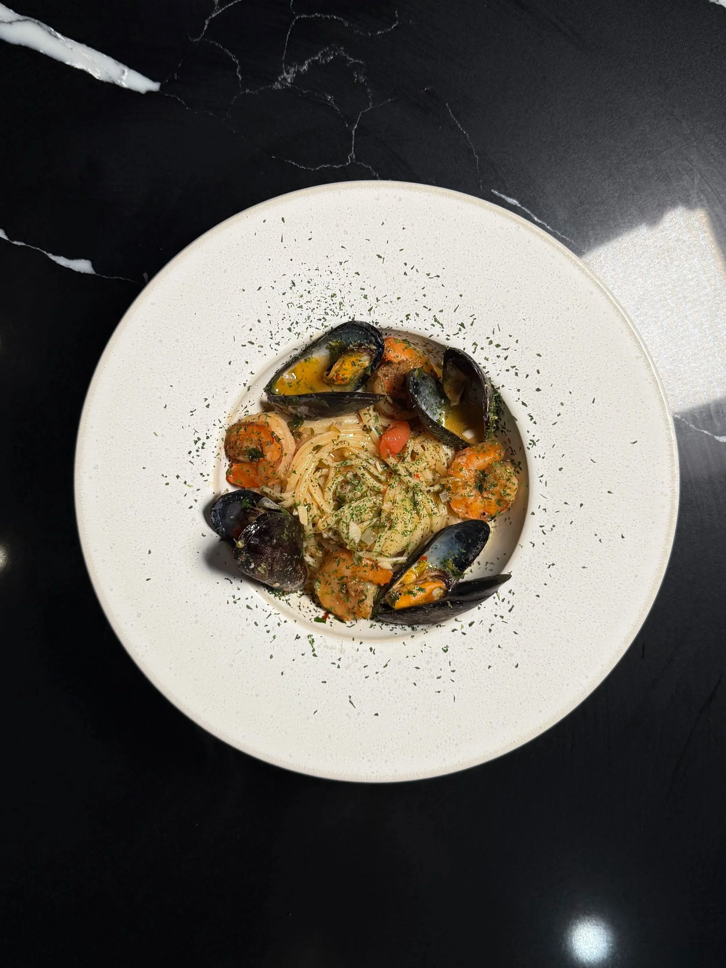 Seafood dish developed through menu curation for a private dining experience by Chino Angles.