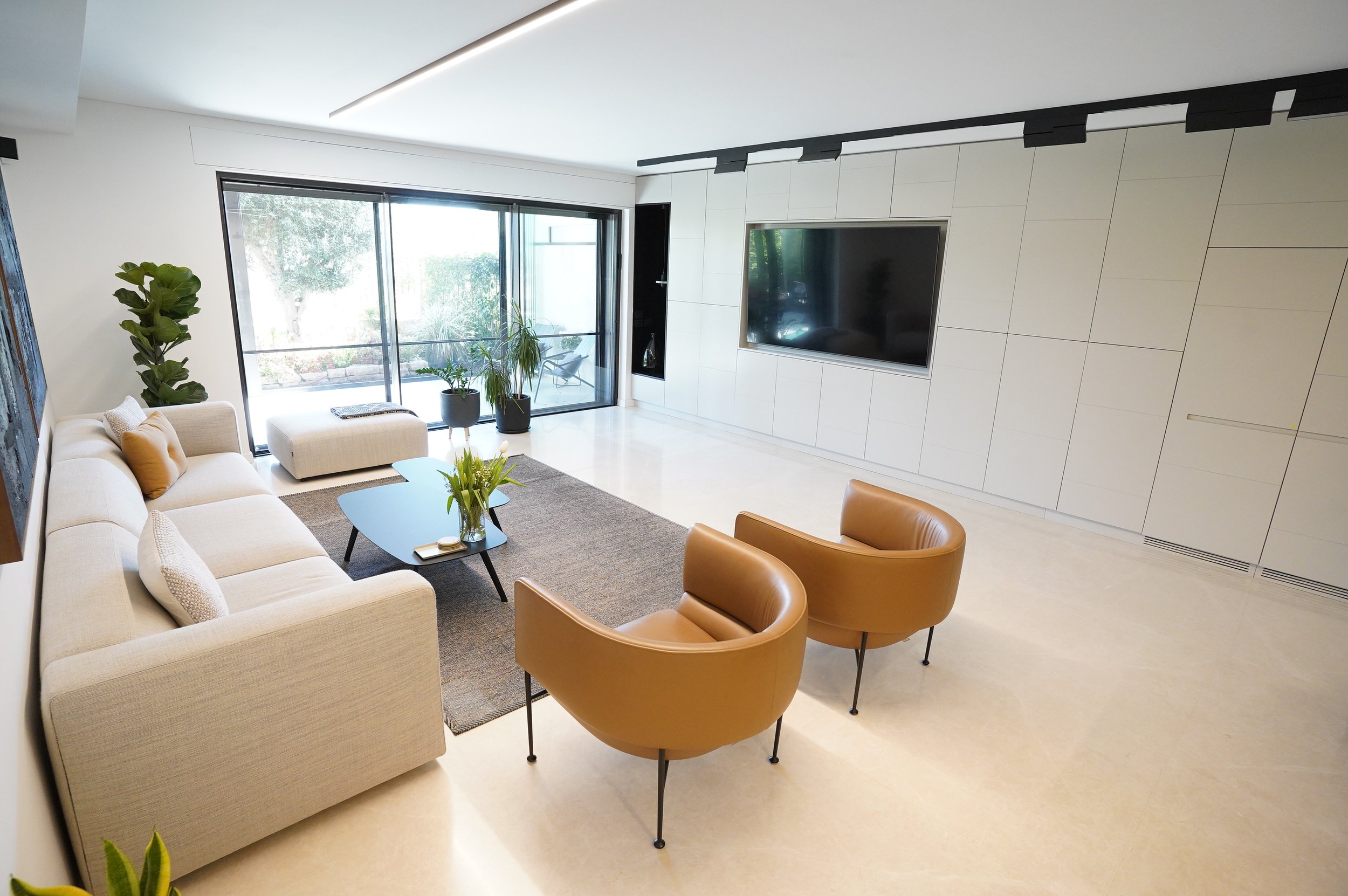 Modern residential living room with custom built-in wall